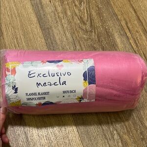 Flannel pink blanket 50x70 inches. 100% polyester.